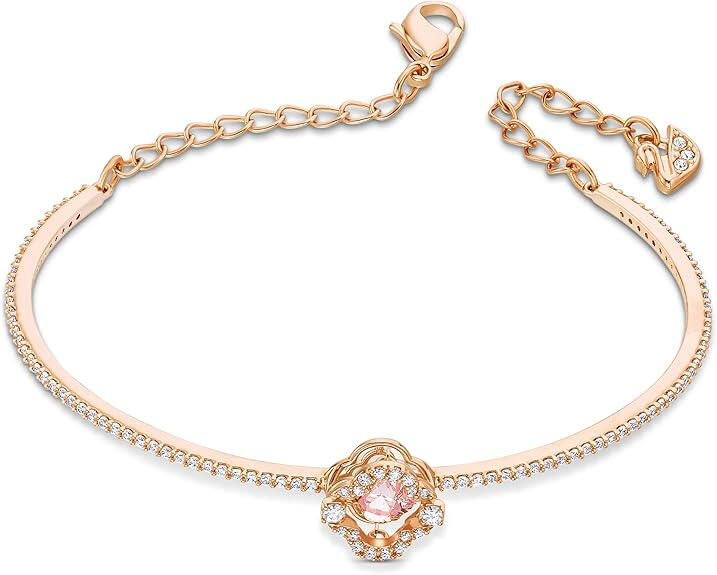 Swarovski Una Clover Bangle Bracelet Swarovski clover-motif bangle on neutral surface